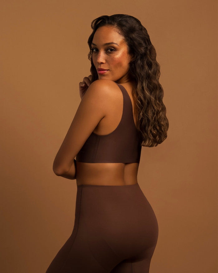 Woman wearing the Seamless Wireless Full Coverage Bra in Hazelnut, back view
